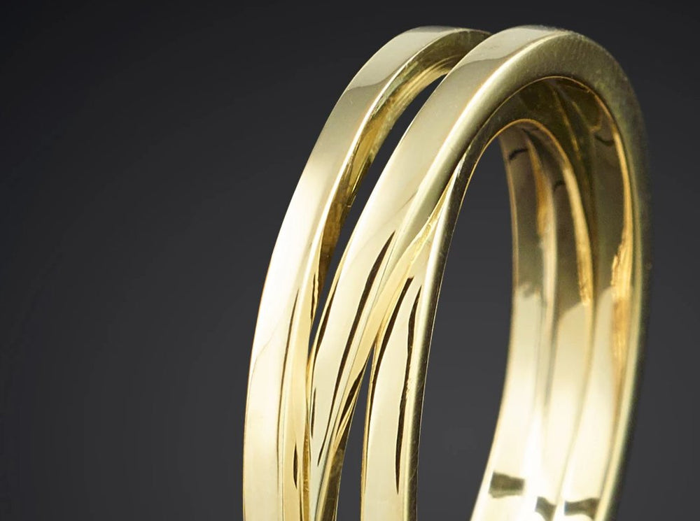 Verwikkeling | 14 karaat geelgouden 3-baans wikkelring