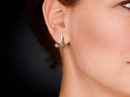 Zeedeining | 14 karaat bicolor geelgouden oorstekers met diamant