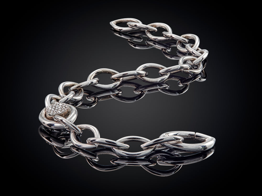 Oogappel | 14 karaat witgouden armband met zwarte en witte diamant